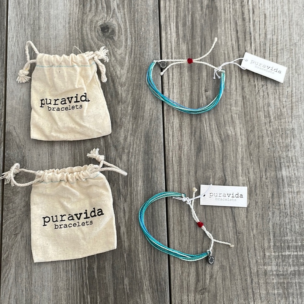 Lot of 2 Puravida bracelets with bags